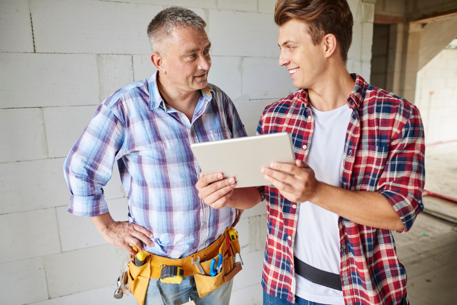 A vinyl fence supplier consulting with a client in Calgary, AB.